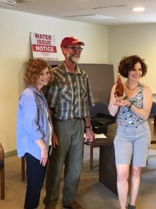 (From left) Sharon, Simons (Chair, Wilderness Ranch Firewise Community Board), Brett VanPaepeghem (IDFW South Project Manager) and Carrie Wiss (Wilderness Ranch resident and former IDFW Board member) accept a 15-year recognition award from Firewise Communities/USA.